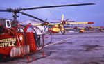 Alouette II F-ZBAE en premier-plan et Bombardiers d'eau de la Protection civile de Marseille-Marignane avant 1975, année de la création de la Direction Sécurité civile - Photo collection F. Delafosse