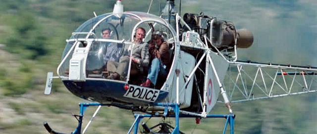 Claude Fourcade aux commandes de l'Alouette 2 dans le film "Comme un boomerang" en 1976 - Photo DR